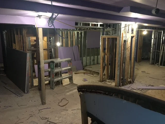 Commercial interior framing with metal studs and drywall panels under construction